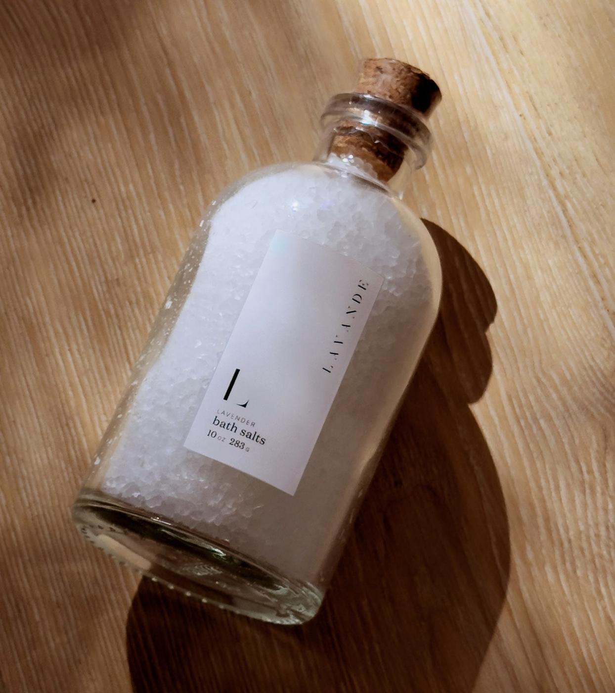 Bottle of bath salts with a cork stopper in warm light