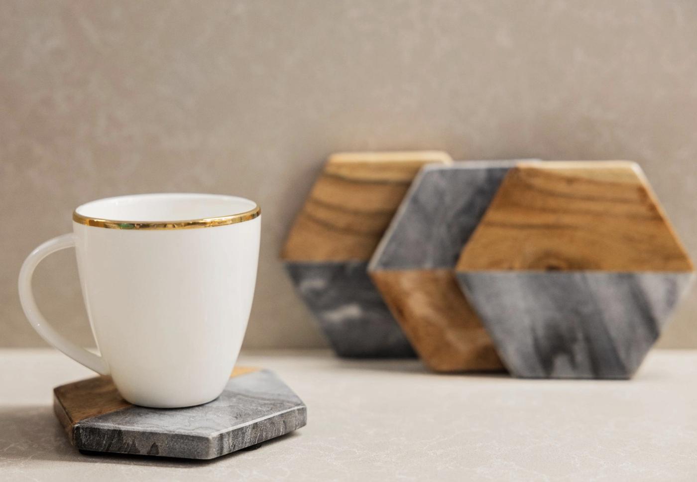 Marble and acacia coasters with a mug